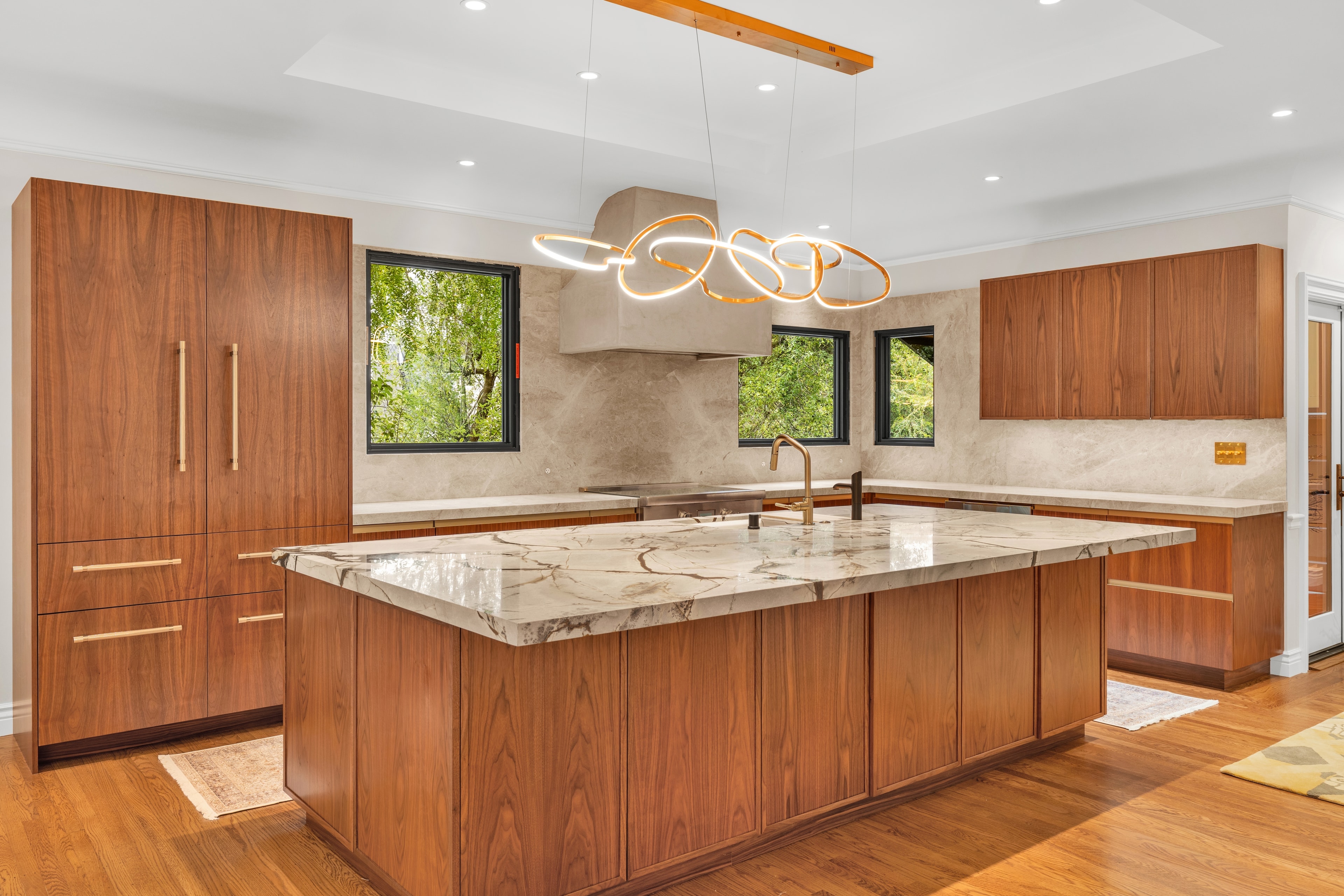 Kitchen island with marble countertop and bar seating